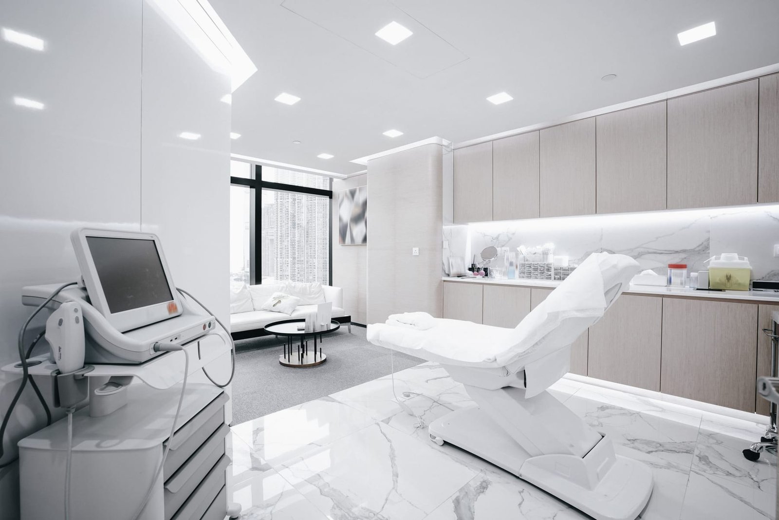 White clinical treatment room with a reclining chair